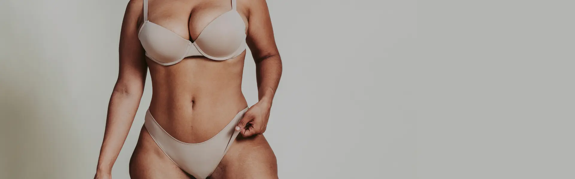A woman in a bikini posing for a photo.