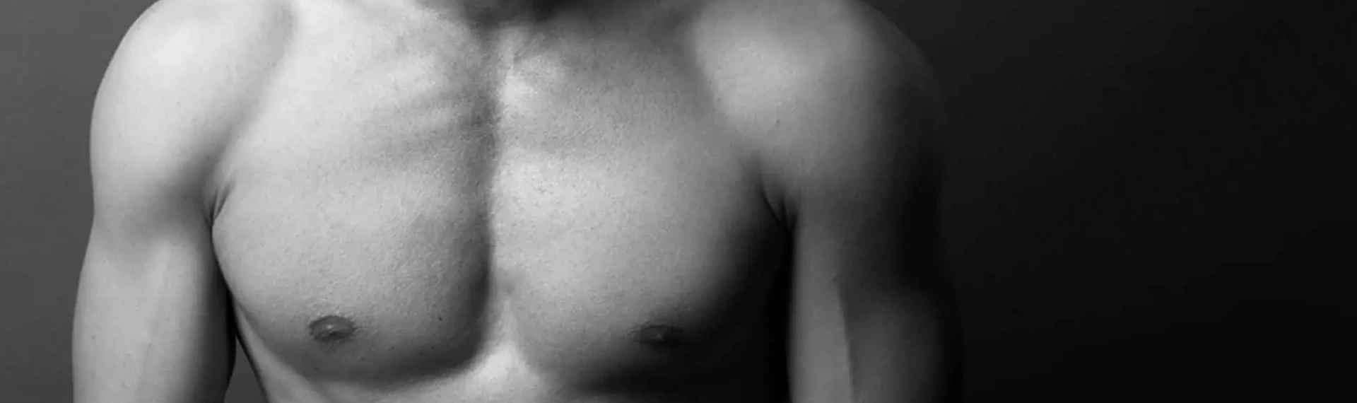 A black and white photo of a shirtless man displaying gynecomastia before and after transformation.