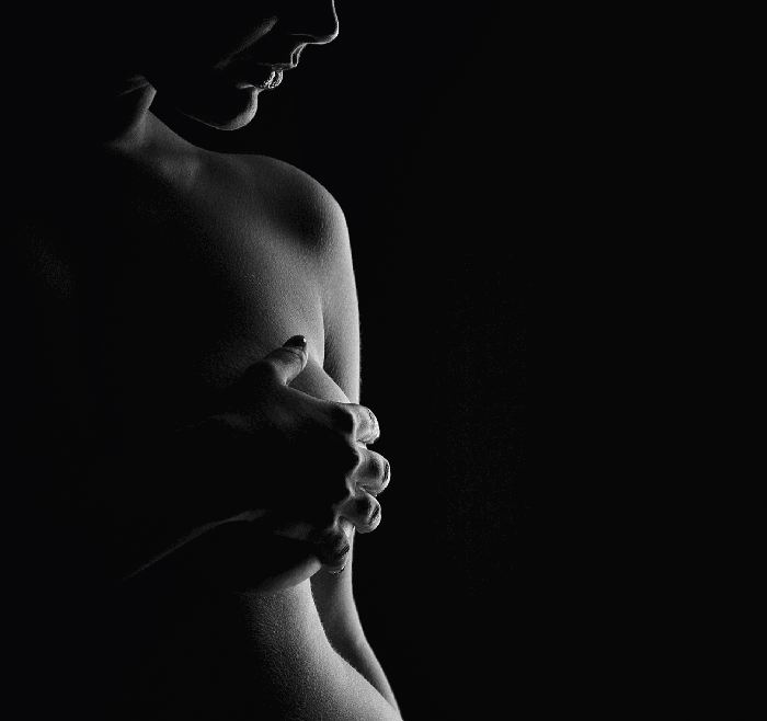A black and white photo of a woman's breast, showcasing the beauty and elegance of the female form.