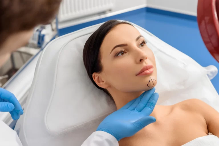 A woman is getting chin lipo in NYC to enhance her facial features.