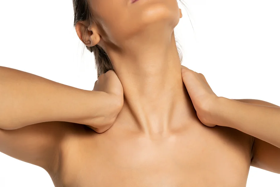a woman performs gentle stretches on her neck post-chin lipo procedure