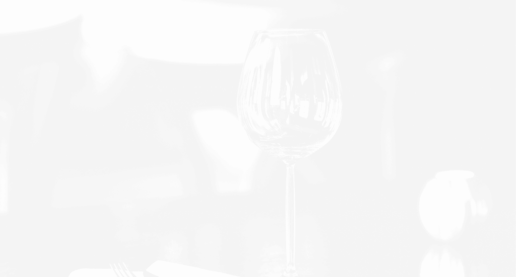 A wine glass on a table.