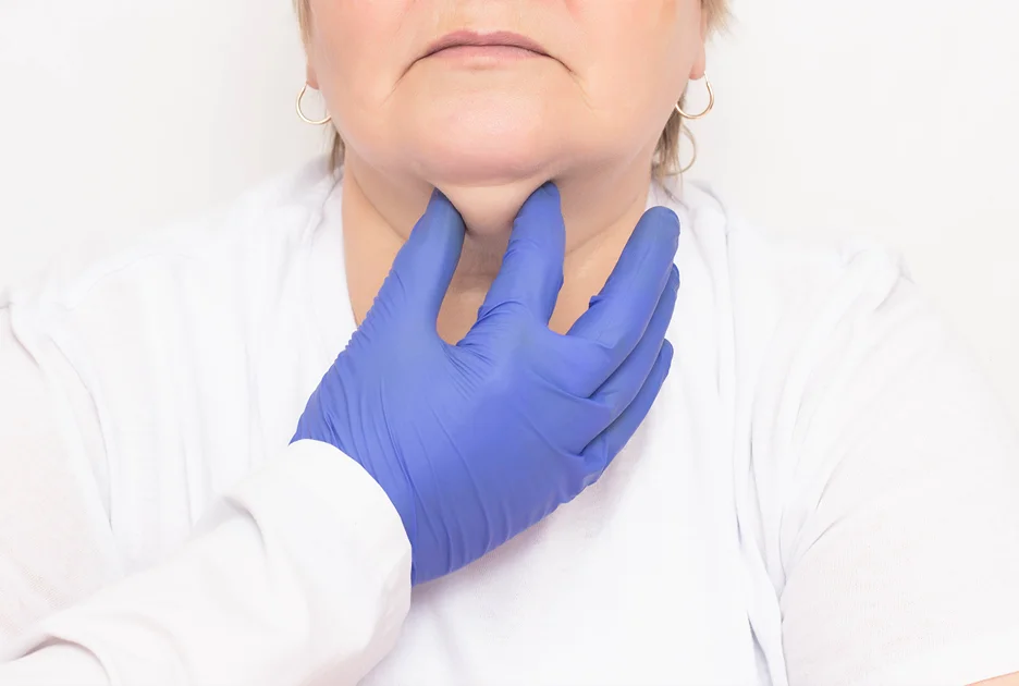 A woman undergoes consultation with her provider for chin liposuction procedure.