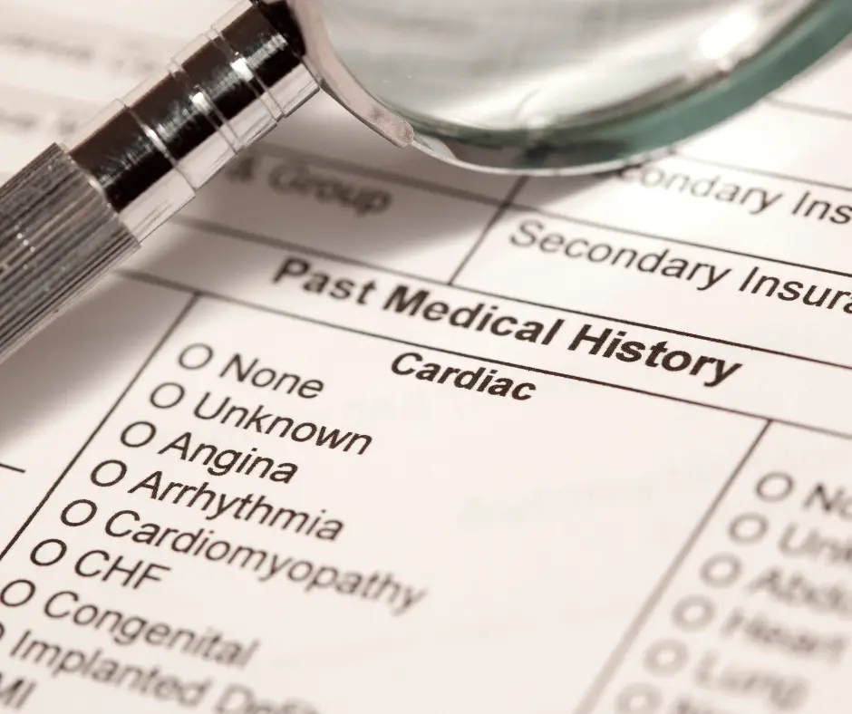 A magnifying glass sits on top of a medical history form, allowing for large volume scrutiny.