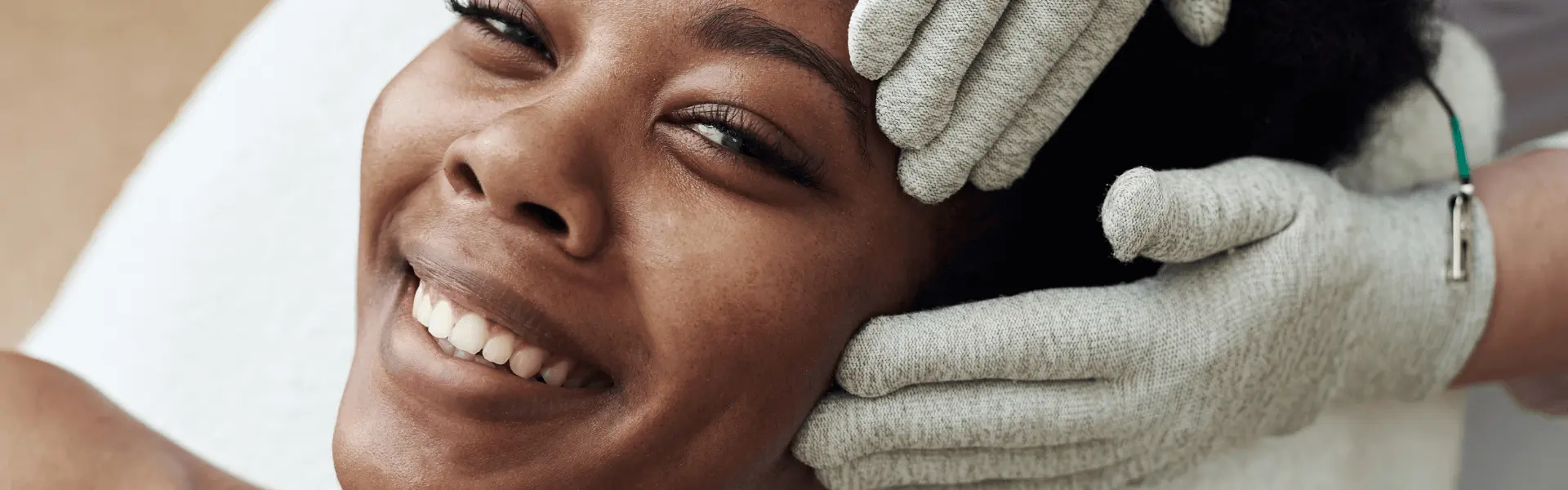 A woman getting a facial treatment at a spa.